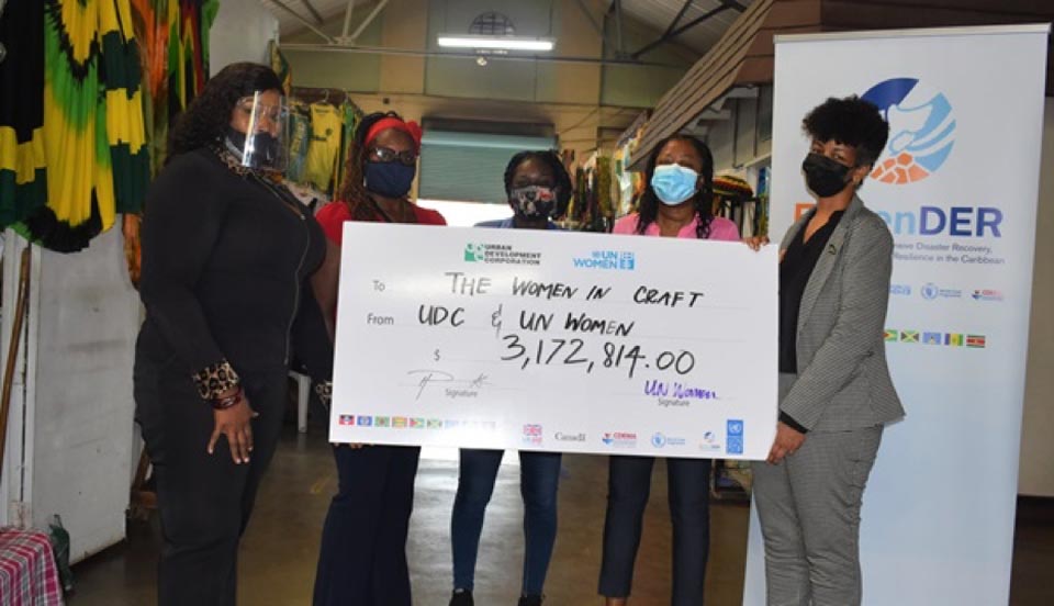 Women and a giant cheque