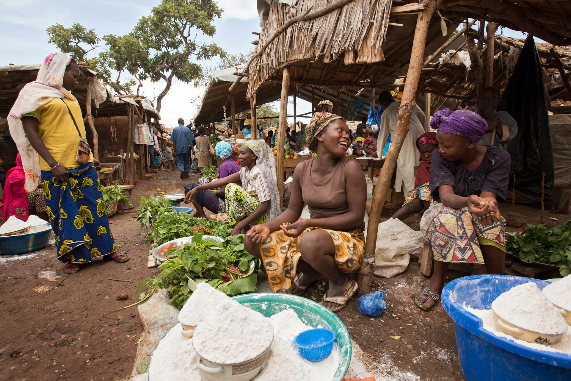 Women sell home-grown vegetables and cassava flour at the market in the Gado refugee camp.