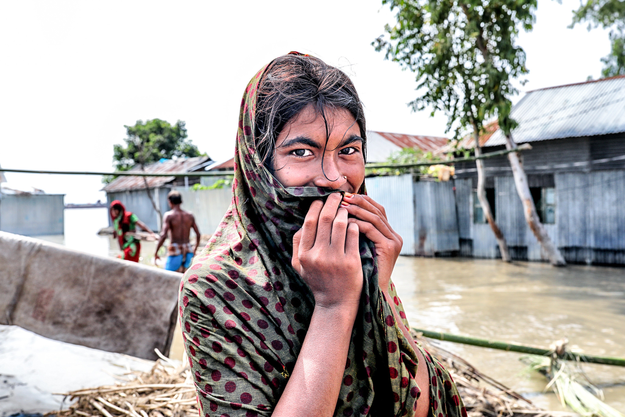 Women in a flooded village