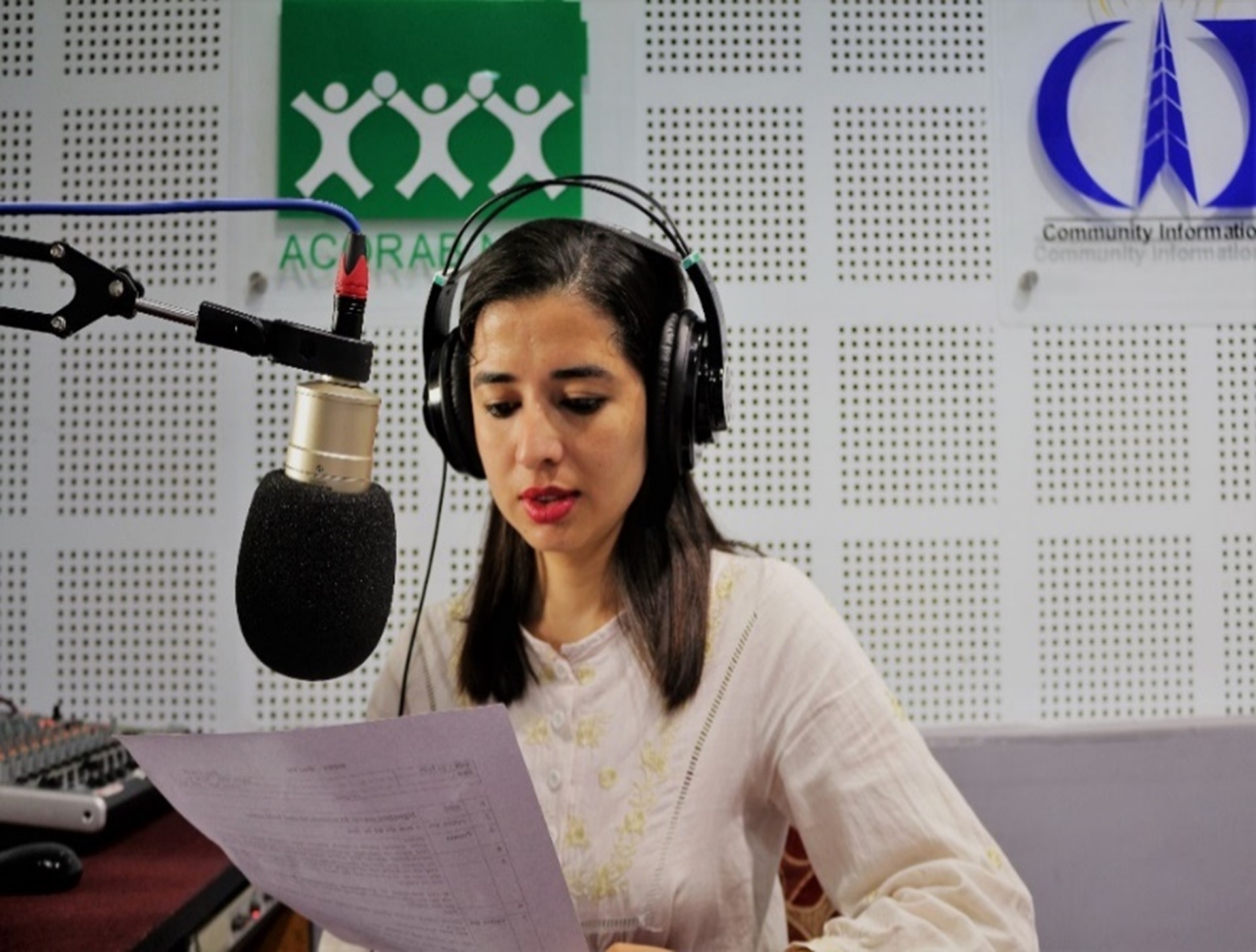 Women providing early warning messages via radio