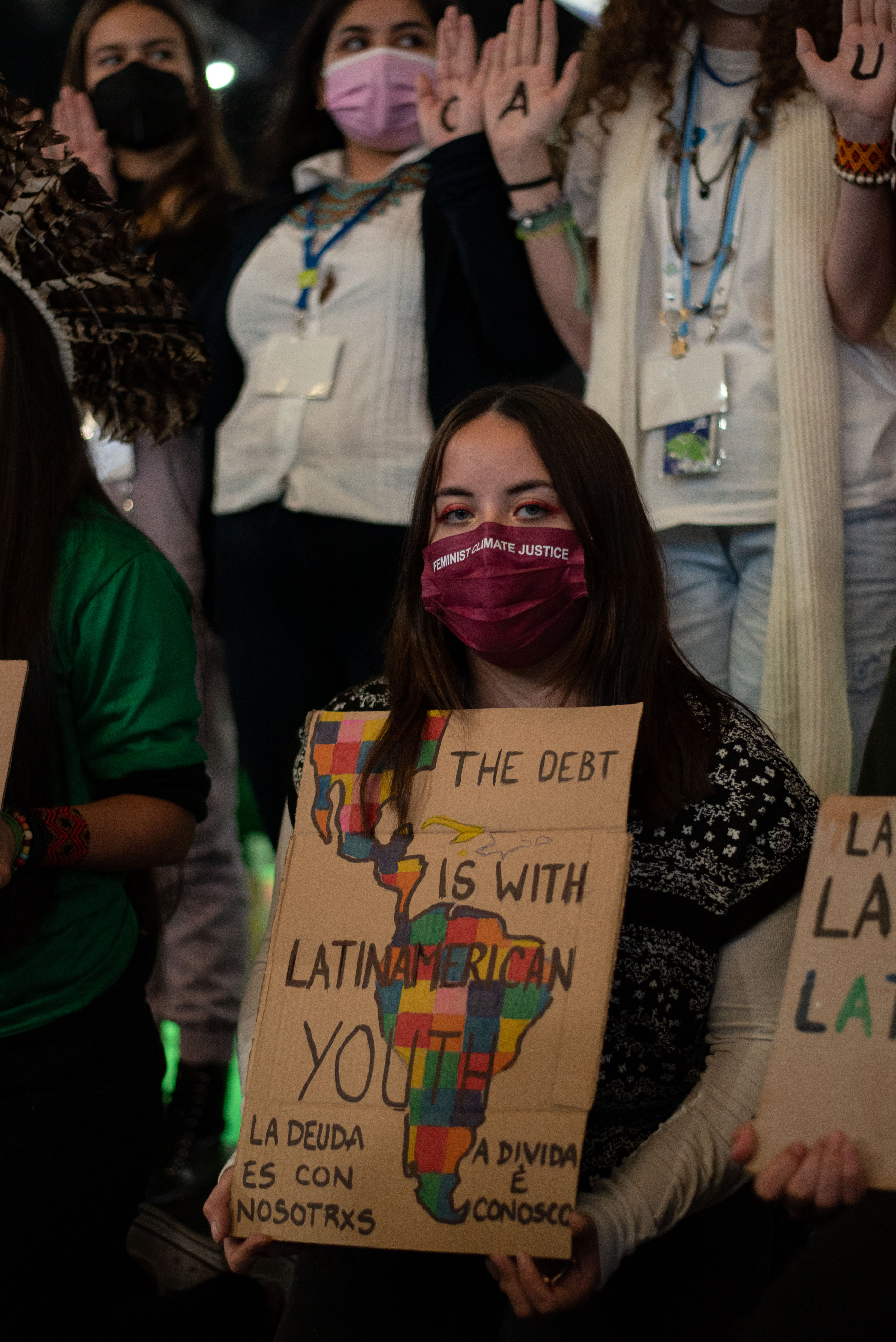 Karin Watson (Chile) with a sign at a demonstration