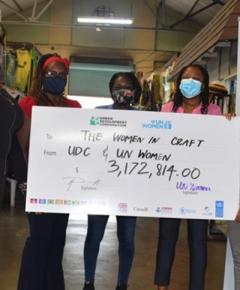 Women and a giant cheque