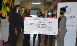 Women and a giant cheque