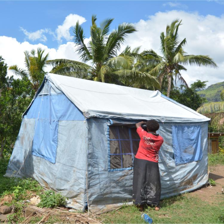 Women putting up a tent