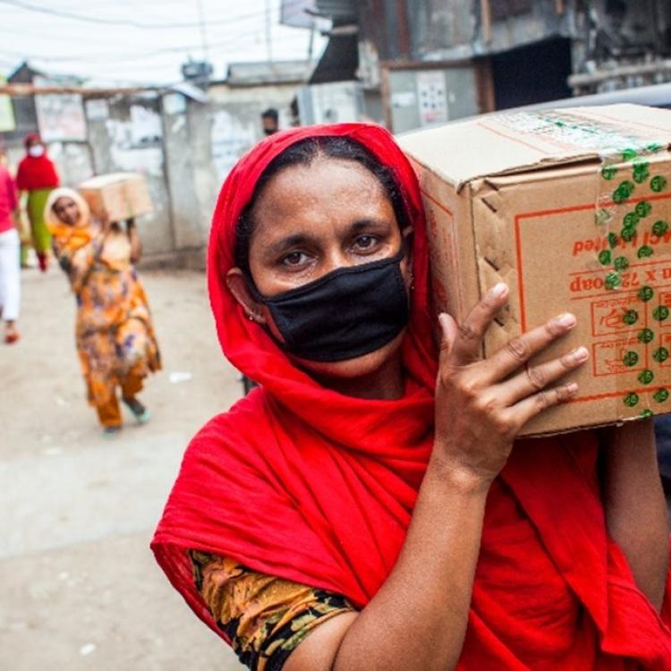 Women carrying a box