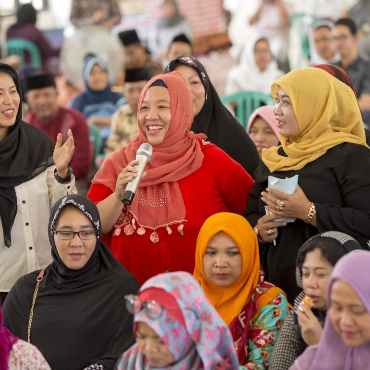 Women sharing her thoughts in a meeting